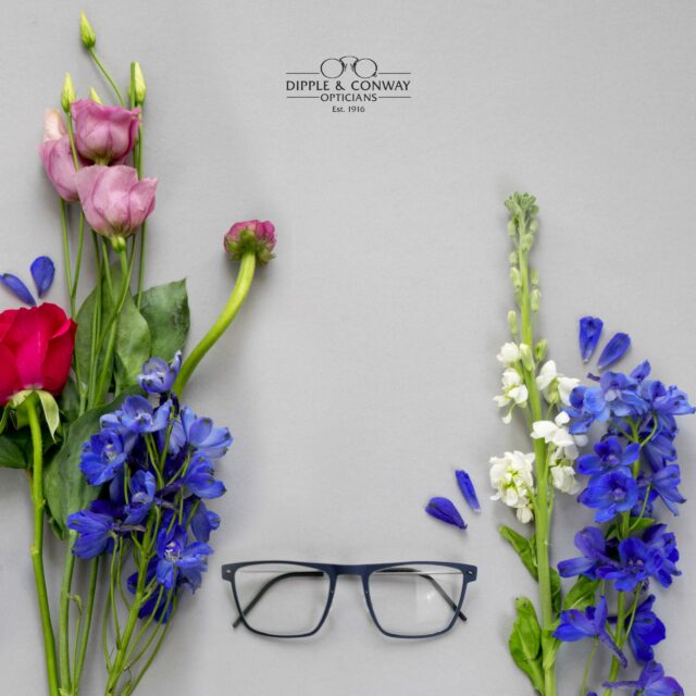 glasses with flowers in background