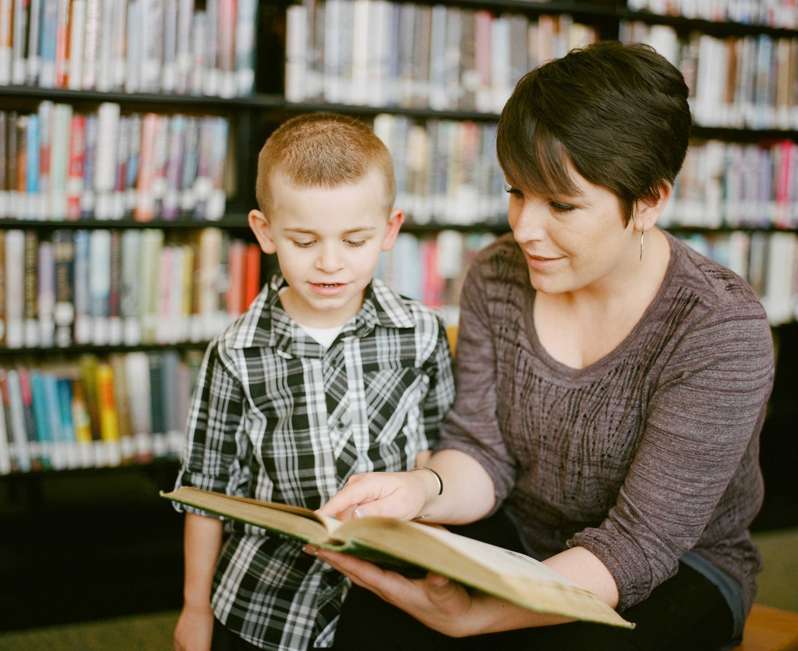 Mother & son reading a book