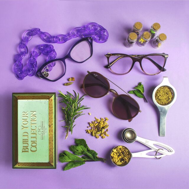 Purple glasses flat lay