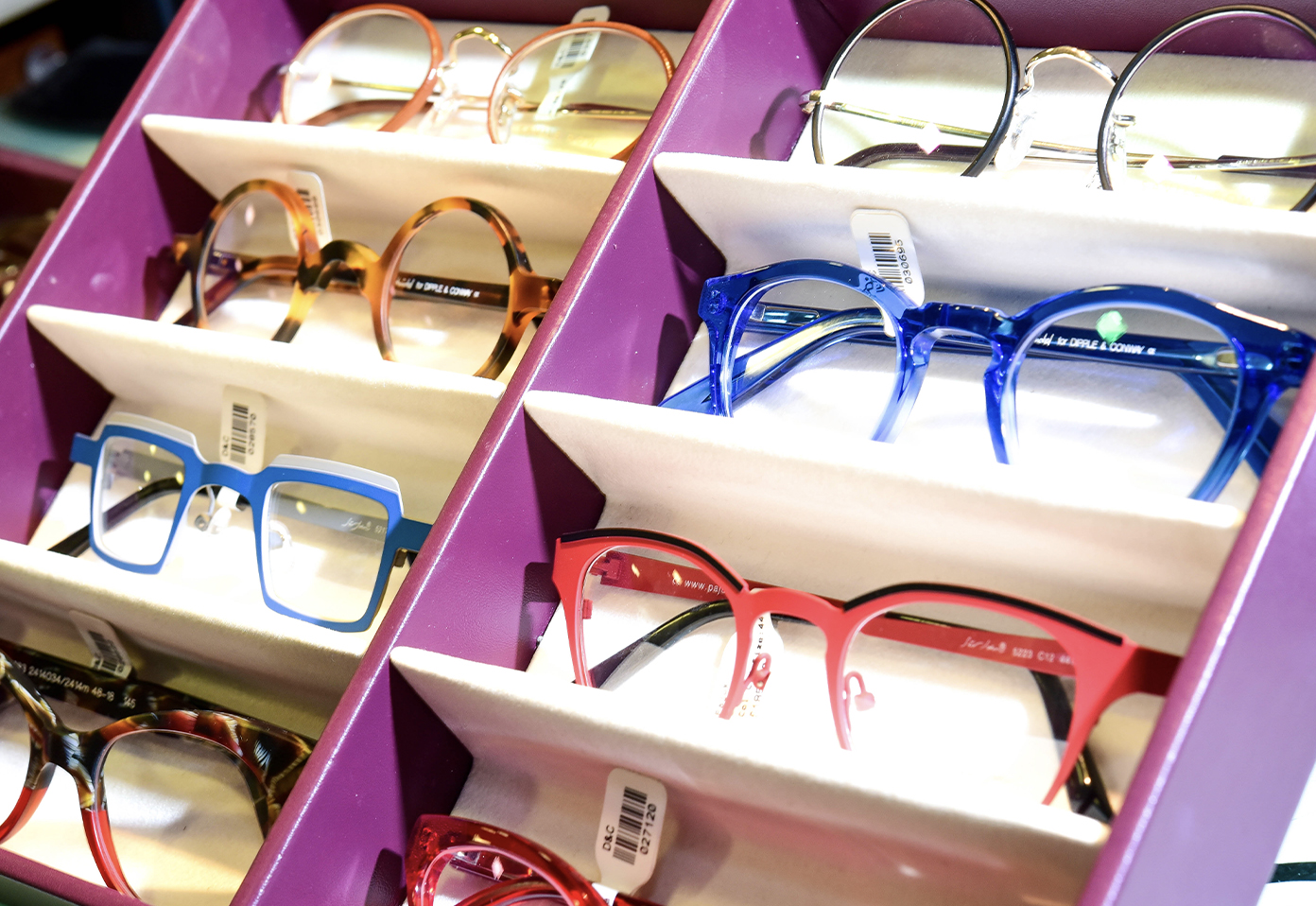 Colourful glasses in boxes